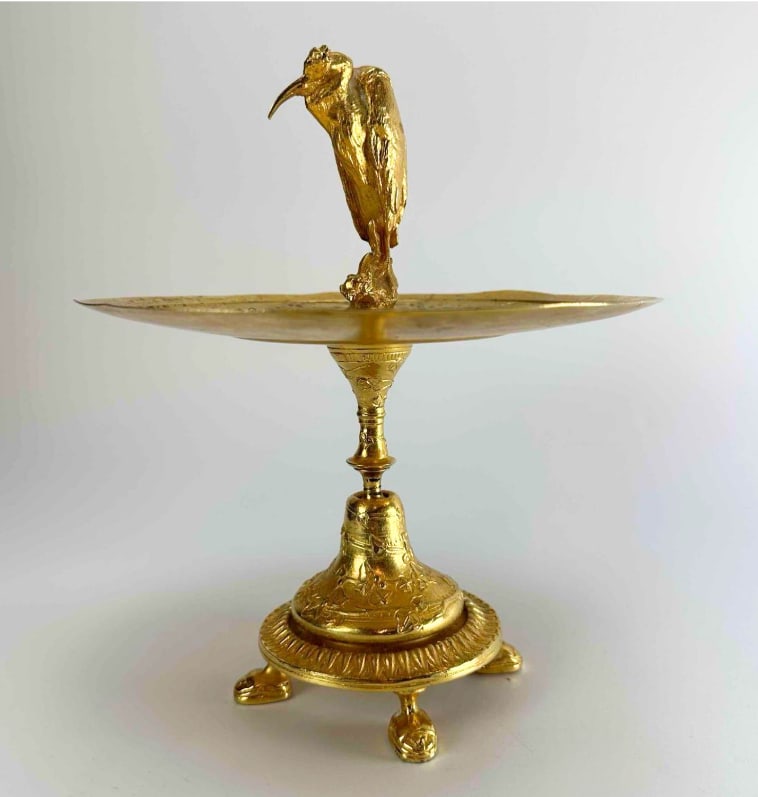19th CENTURY FRENCH GILT BRONZE FIGURAL TAZZA: Gilt bronze tazza, the shallow engraved dish centred by a standing draped figure, raised on a fluted socle and tripod paw foot base Approximate Dimensions: 9" H x 8" Dia Artist or Maker: Unkno