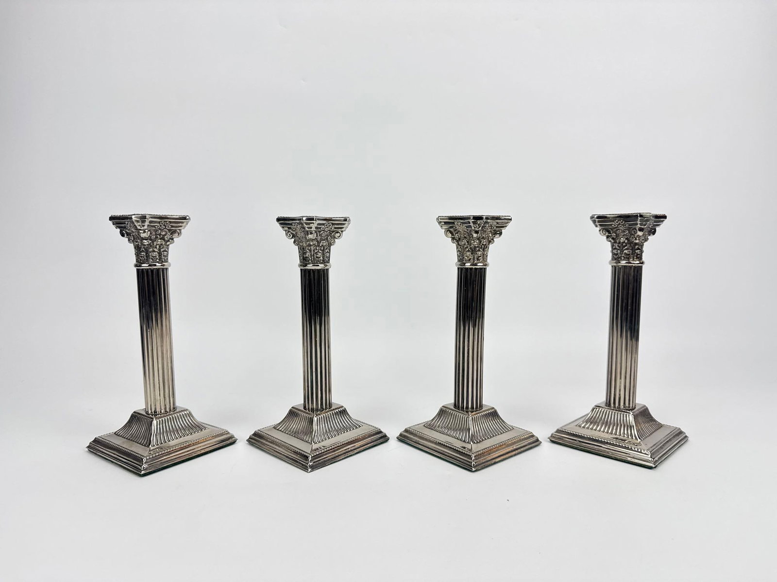FOUR ENGLISH WEIGHTED SILVER PLATED CORINTHIAN COLUMN CANDLE HOLDERS (1 of 6)