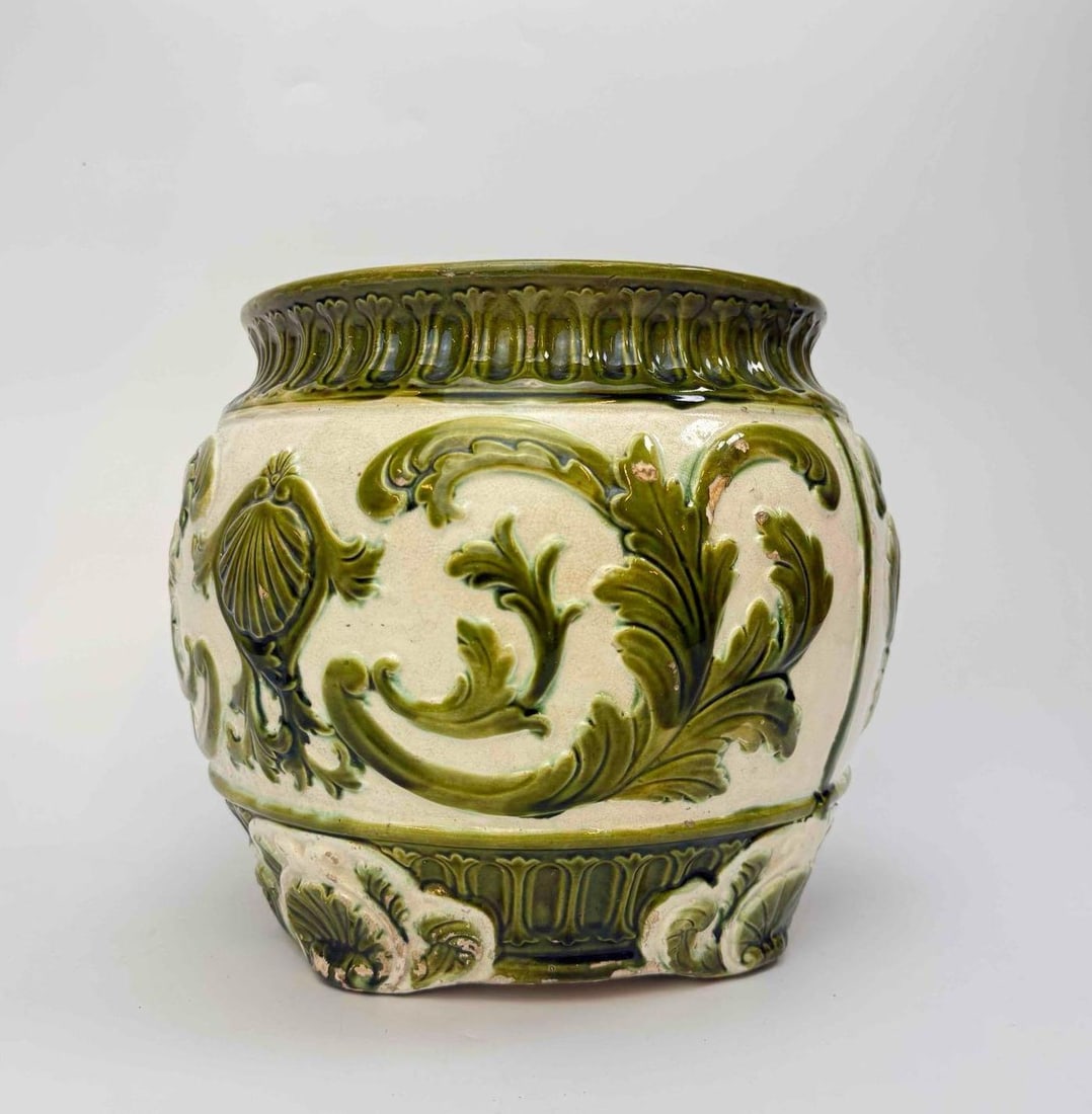 MAJOLICA GLAZED CERAMIC JARDINIERE, GREEN ACANTHUS AND SCROLL RELIEF: Majolica glazed ceramic jardiniere of bulbous form, moulded acanthus leaf and scroll relief in green over a cream ground, gadrooned collar and shaped foot, turquoise glazed interior Approximate Dimens