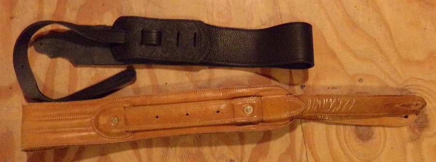 Two Leather Guitar Straps 1 Black 1 Light Brown: Two Leather Guitar Straps. One Black Leather. One Light Brown Leather.