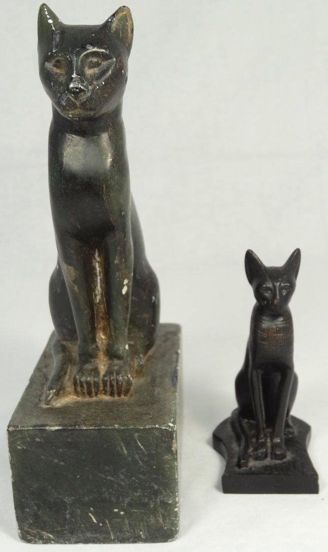 A lot of 2 modern figurines of cats modeled MET: A lot of 2 modern figurines of cats modeled off of the well-known bronze cat at the Metropolitan Museum of Art in New York City. The first is a nicely done resin copy of the seated cat with sharp feat