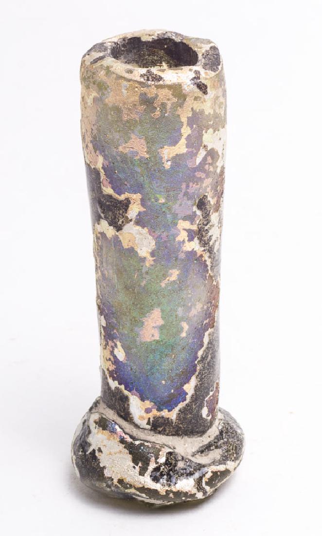 Ancient Islamic Footed Glass Vase c.9th century AD: Ancient Islamic Footed Glass Vase c.9th century AD. Size 2 7/8 inches high. beautiful iridescence on greenish thick glass vase. perfect condition. Provenance: From Dana E. Zeilinger NH USA Collection.