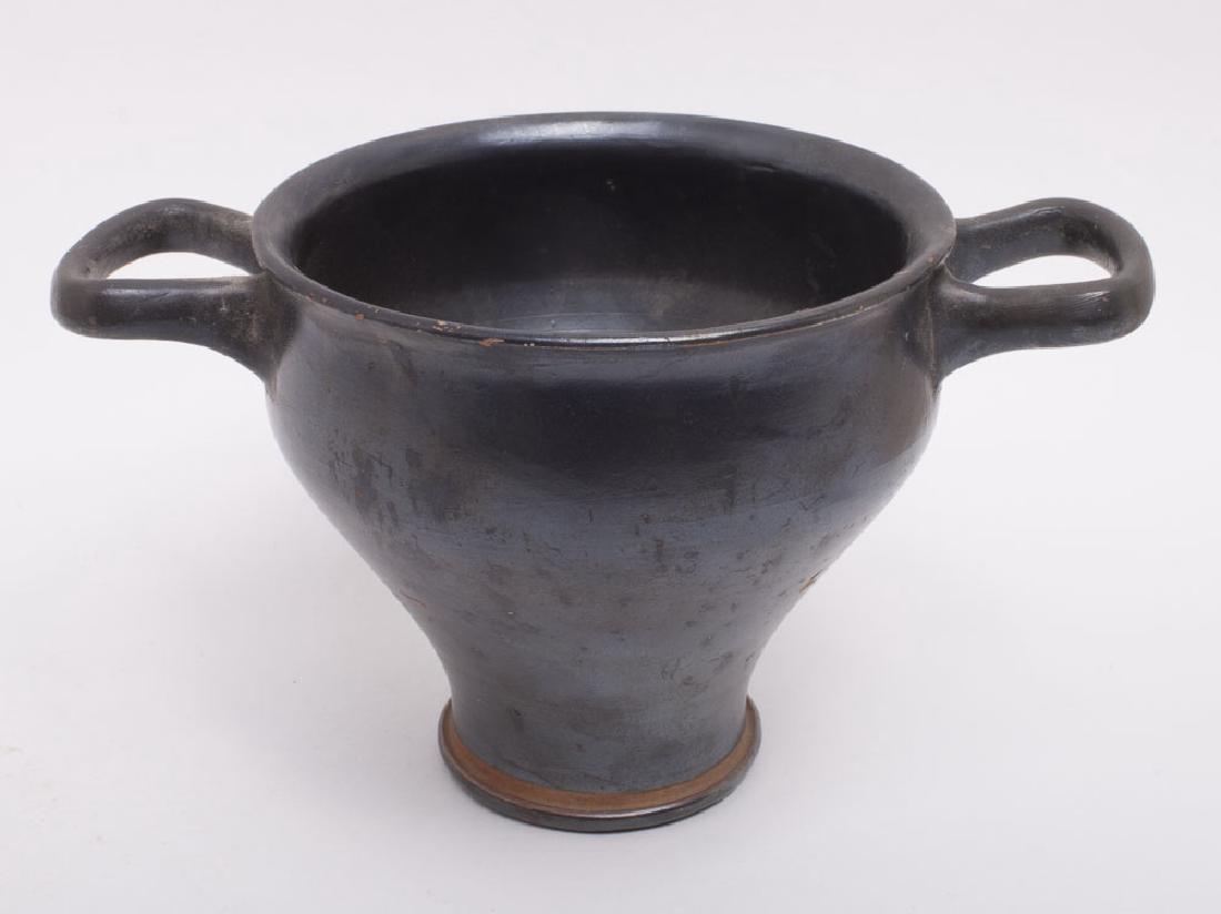Ancient Apulian Pottery Skyphos Circa 4th Century BC.: Ancient Apulian Pottery Skyphos Circa 4th Century BC. Size 4 inches High by 6 7/8 inches across handles. Condition: Perfect. Provenance: from the estate of Robert Thompson of Philadelphia, Pennsylvani