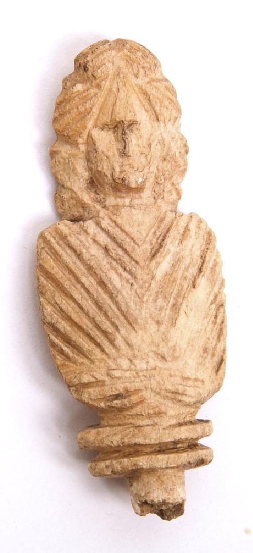 Ancient Roman Pin Top Toga Bust c.1st-4th century AD: Ancient Roman Pin Top Toga Bust c.1st-4th century AD. Size 2 inches high. Fine Craved Bone bust with a toga. Condition: missing pin bust is perfect. Provenance: from the estate of Robert Thompson of P