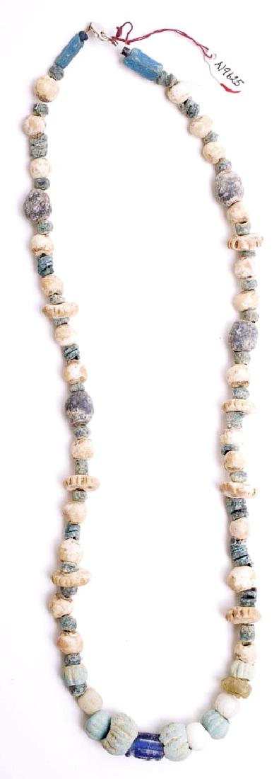 Ancient Islamic Faience and Glass Beads Necklace c.7th: Ancient Islamic Faience and Glass Beads Necklace c.7th century AD. Size 23 inches length. Ancient Islamic faience and glass beads set in a necklace. Condition: perfect. Provenance: from the estate of