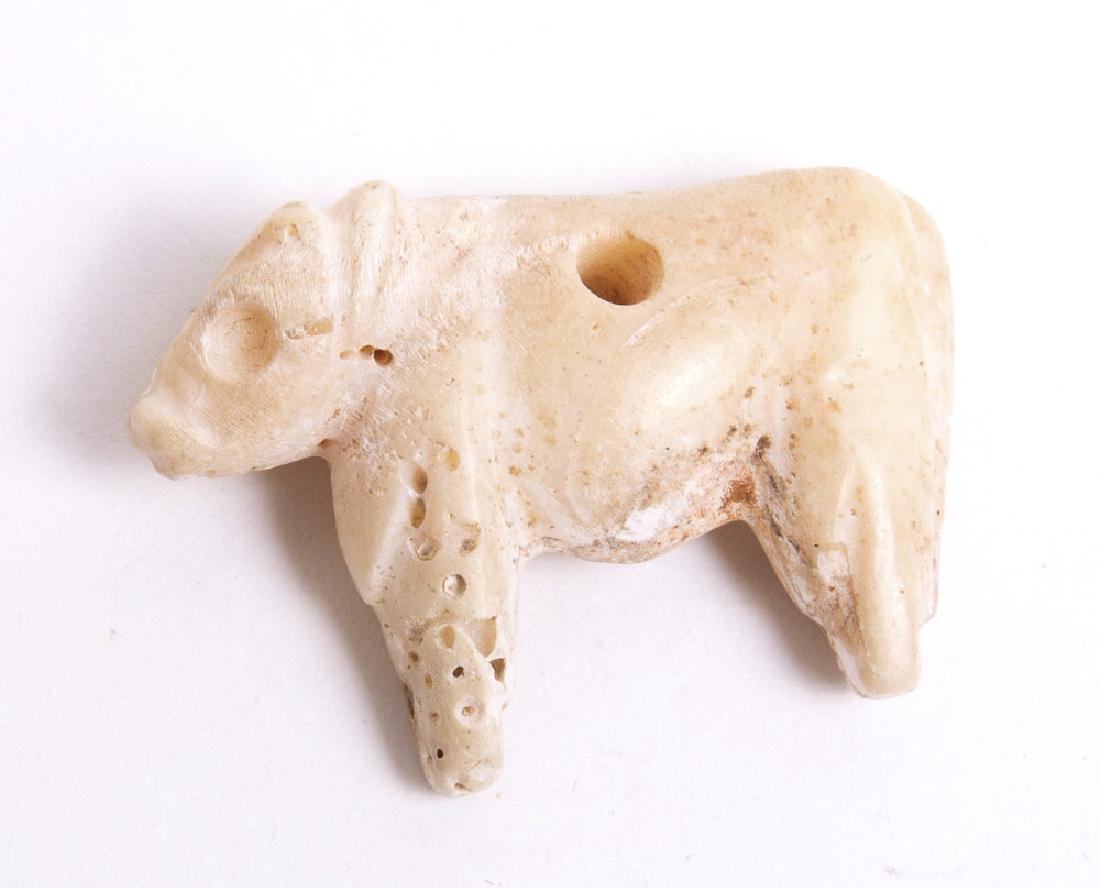 Ancient Holy Land Bronze Age Shell Cow c.3000 BC: Ancient Holy Land Bronze Age Shell Cow c.3000 BC. Size 34 mm. Rare Carved shell amulet of a cow with a hole through the center. Condition: perfect. Provenance: from the estate of Robert Thompson of Ph