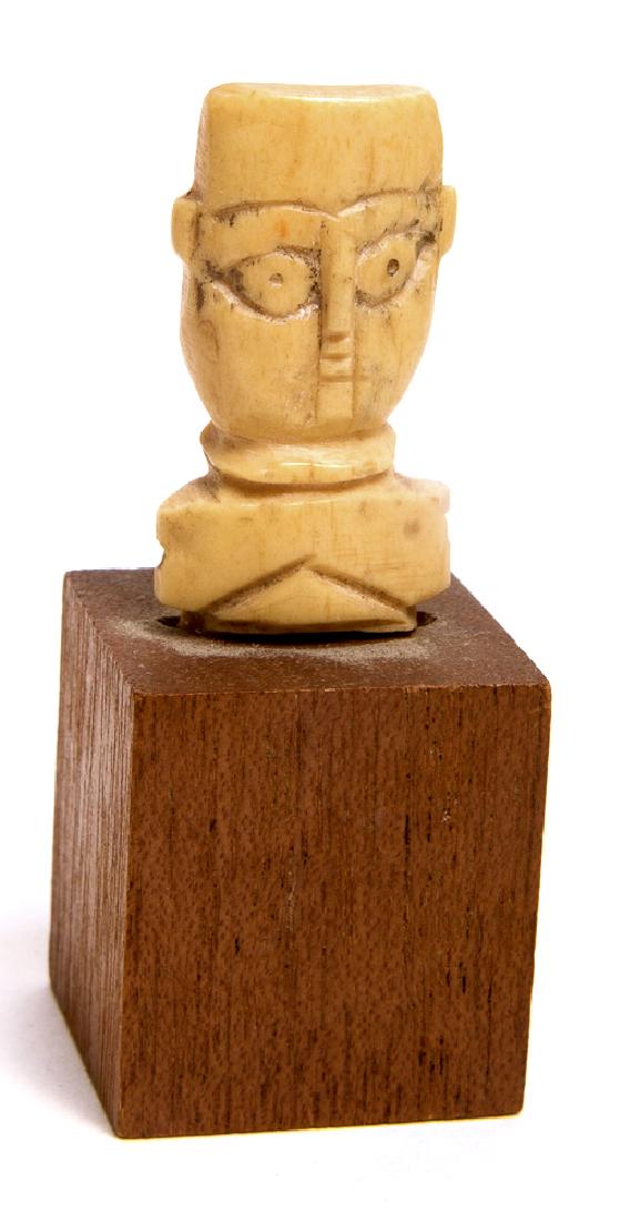 Ancient Egypt Coptic Bone Idol c.2nd-5th century AD.: Ancient Egypt Coptic Bone Idol c.2nd-5th century AD. Size of head 1 1/2 inches high. Fine Ancient Bone head of an Idol with nice details a fragment from a full statue. Condition: perfect. Provenance: 