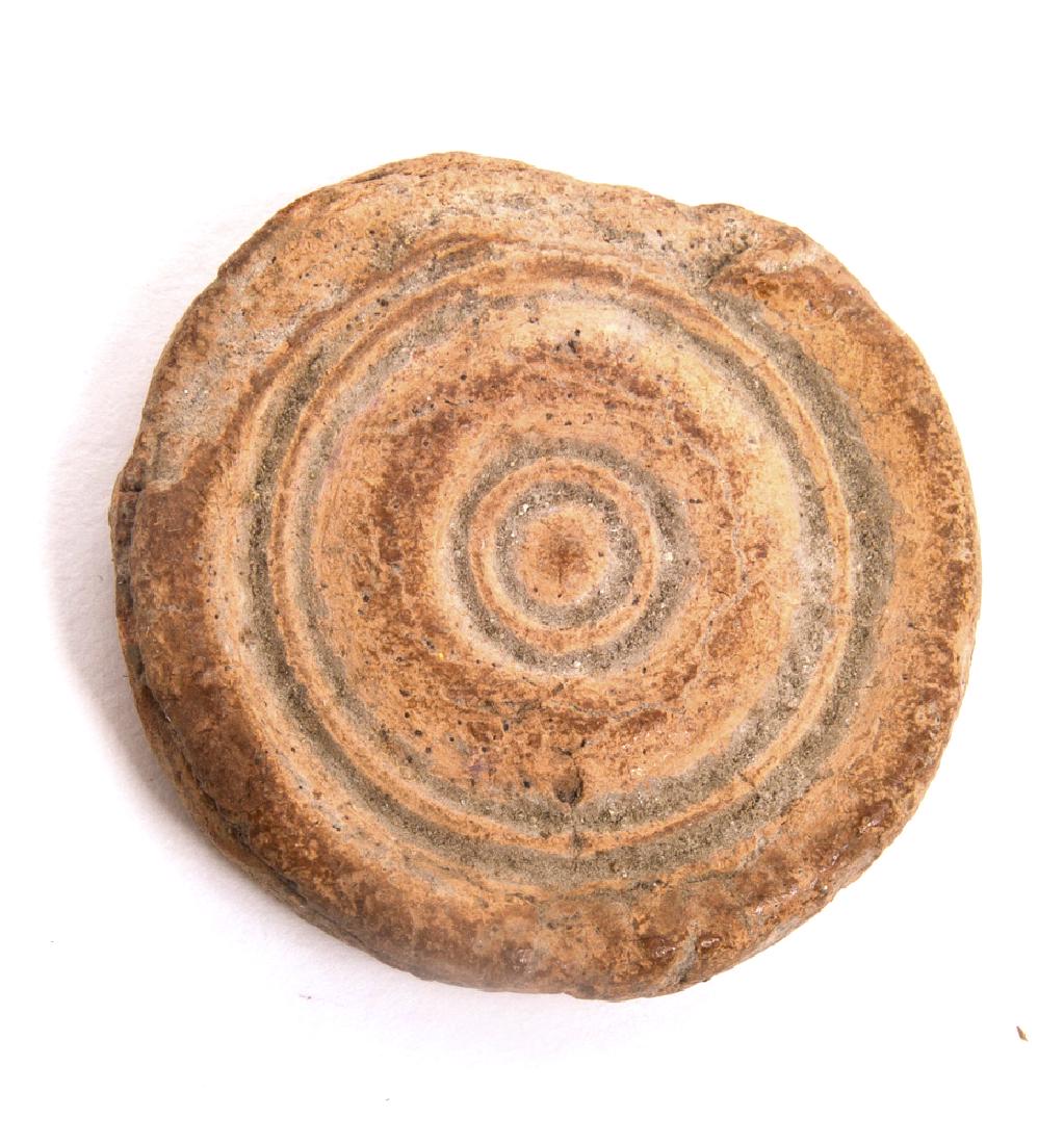 Ancient Byzantine Terracotta Game Piece c.8th century A: Ancient Byzantine Terracotta Game Piece c.8th century A.Size 1 1/4 inches diameter. Unusual Round terracotta game piece. Condition: chips and losses. Provenance: from the estate of Robert Thompson of