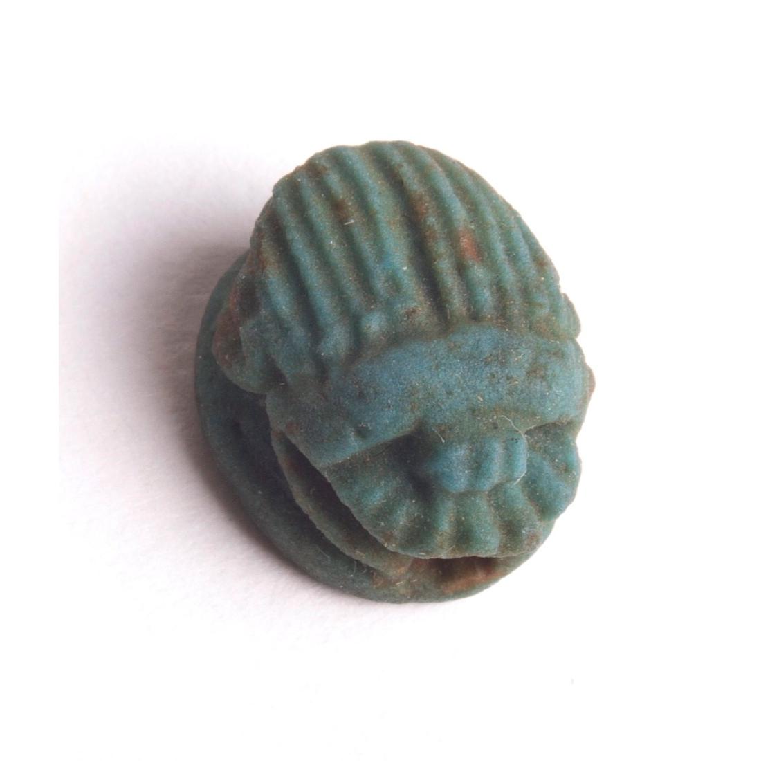 Ancient Egyptian Green Faience Scarab c.300 BC: Ancient Egyptian Green Faience Scarab c.300 BC. Size 14 x 12 mm. Lovely little green scarab with fine details. condition: tiny very small chip otherwise Perfect. Provenance: Ex The Time Machine New Yo