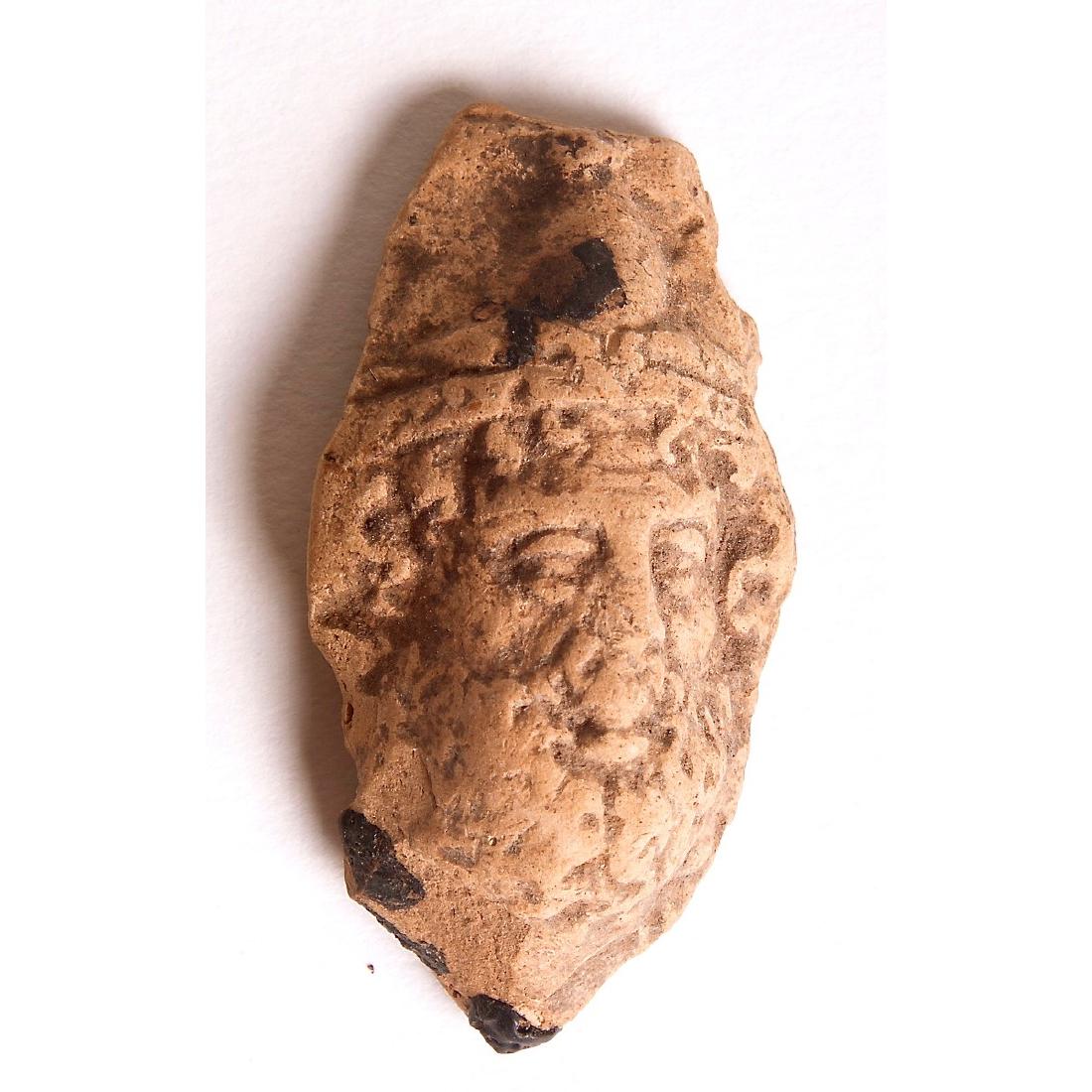 Ancient Roman Egypt Terracotta Face of Serapis c.1st-2n: Ancient Roman Egypt Terracotta Face of Serapis c.1st-2nd cent AD. Size of face 1 3/4 inches high. A Terracotta Face relief of Serapis with nice details, a Fragment from a figure. Condition: perfect. P