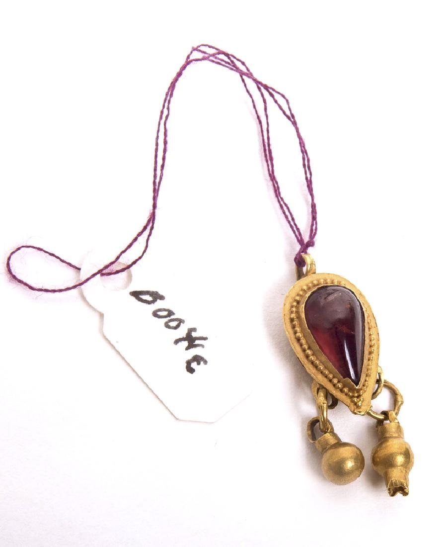 Ancient Roman Gold Pendant c.1st century AD.: Ancient Roman Gold Pendant c.1st century AD. Size 1 inches length. a Beautiful high karat gold pendant with garnet. Condition:perfect. Provenance: from the estate of Robert Thompson of Philadelphia, P