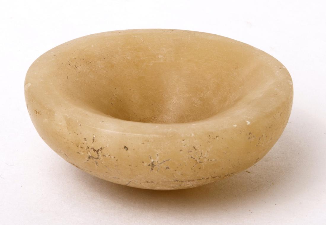 Ancient Byzantine Alabaster Bowl c.6th century AD: Ancient Byzantine Alabaster Bowl c.6th century AD. size 2 1/4 inches diameter. Fine Carved Alabaster Bowl with etched ornate design at bottom. Condition: Perfect. Provenance: Ex, Robert Thompson, Ex T