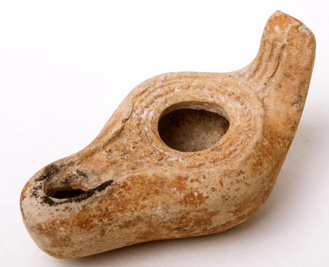 Ancient Byzantine Terracotta Oil Lamp with Cross: Ancient Byzantine Terracotta Oil Lamp with Cross c.5th-6th century AD. size 4 inches length. A Terracotta oil lamp Christian with a Cross on Nozzle. Condition:perfect. Provenance: Private Collection o
