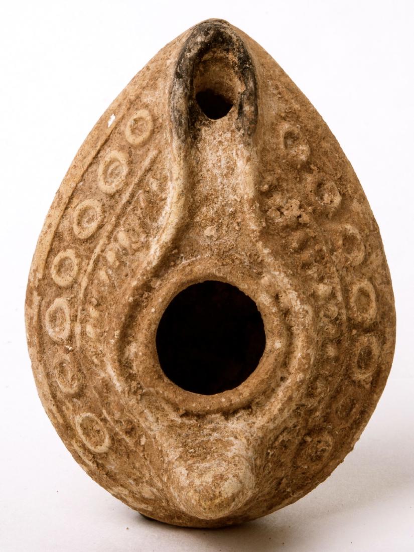 Ancient Byzantine Jewish Oil Lamp with Star Of david: Ancient Byzantine Jewish Oil Lamp with Star Of david c.5th century AD. Size 3 1/2 inches length. Unusual Ancient Holy Land Jewish Oil Lamp with 6 pointed Star Of David at Base. Intact and very scarce.