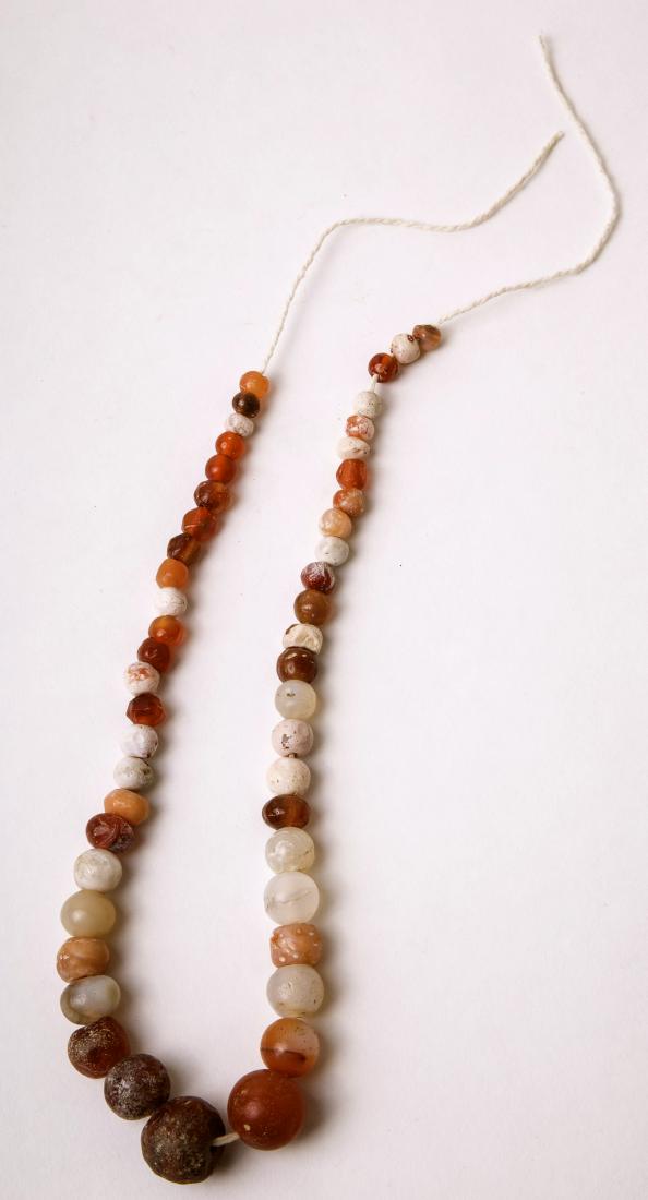 Ancient Roman Agate Beads Necklace c.2nd century AD.: Ancient Roman Agate Beads Necklace c.2nd century AD. size 17 inches length. Beads size 20-7 mm. Beautiful large size beads red agate (Carnelian) in a Strand. Condition: wear due to age and chips other