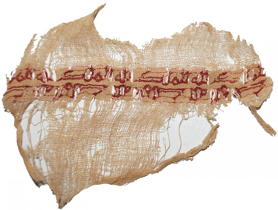 A Fatimid Egypt Inscribed Silk and Linen tiraz textile: A Fatimid Egypt Inscribed Silk and Linen tiraz textile fragment, c. 10th Century AD. Size 3 3/4 x 2 1/2 inches. Rare Fatimid Islamic Textile fragment composed of beige linen warp and weft threads, ins