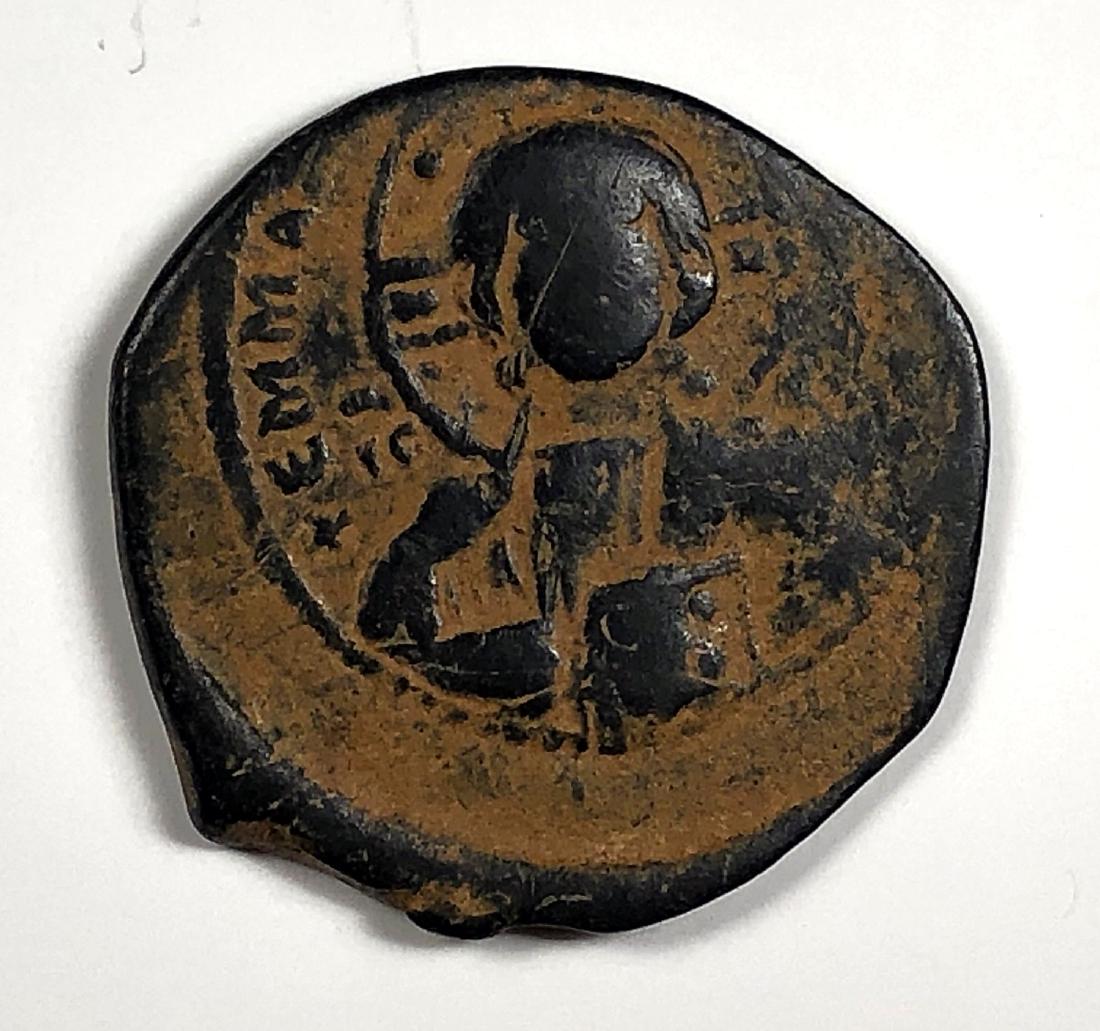 Anonymous. Time of Romanus III, c.1028-1034. Æ Follis: Anonymous. Time of Romanus III, circa 1028-1034. Æ Follis (9.43 gm, 10.90mm). nimbate bust of Christ facing, holding book of Gospels/ IS XS/bAS-ILE/bAS-ILE in three lines, cross, with pellet at each