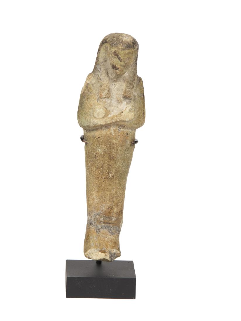Ancient EGYPTIAN Faience Ushabti Late Period c.664-332: Ancient EGYPTIAN Faience Ushabti Late Period c.664-332 BC BC. Size 4 7/8 inches high. A mummified form green faience Ushabti figure, with tripartite wig, beard of Osiris, the arms shown crossed and ho