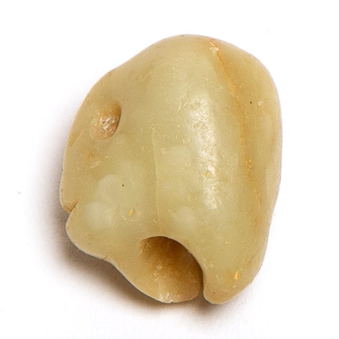 Ancient Syno-Syrian Stone Amulet c.3300-1200 BC.: Ancient Syno-Syrian Stone Amulet c.3300-1200 BC. Size 20 x 17 mm. A Very "ghosty" Bronze age Chalcedony human head amulet. Ancient losses otherwise perfect. Ex The time machine.