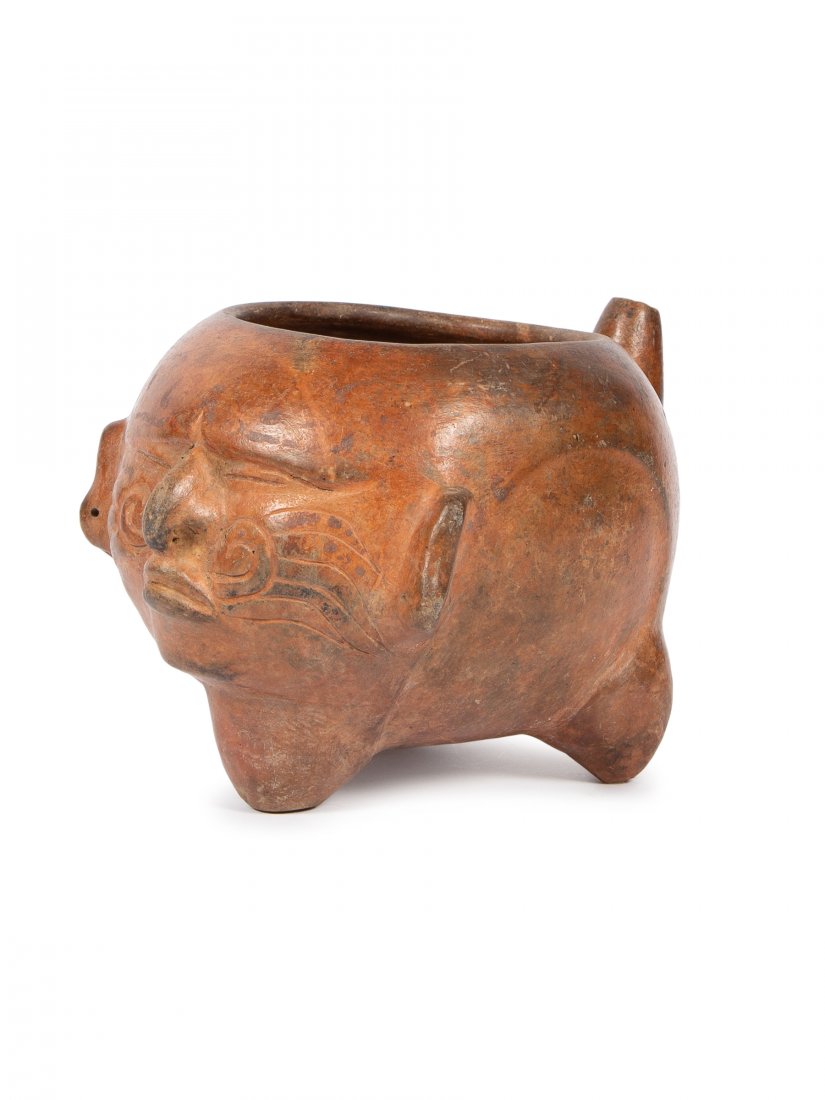 Ancient Pre Columbian Maya, Mexico Pottery Vessel: Ancient Pre Columbian Maya, Mexico Pottery Vessel 550-950 AD. Size 10 1/2 inches Length X 6 1/2 inches High. Tripod Vessel depicting the Face of a Shaman in Trance wearing a Bird Feather Nose Ornament