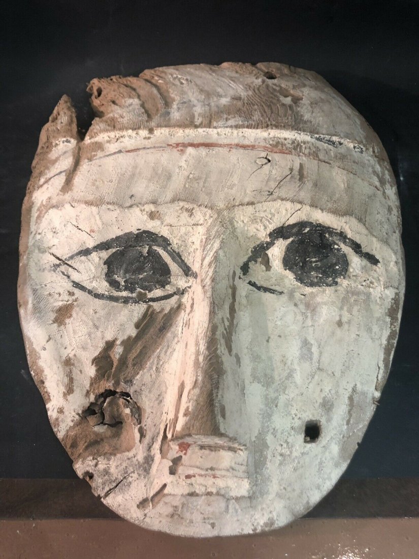Ancient Egyptian Mummy Wood Mask c.664-332 BC. Size 10: Ancient Egyptian Mummy Wood Mask c.664-332 BC. Size 10 5/8 inches high x 8 1/4 inches wide. Fine Ancient Egyptian Mummy Wood Mask painted in white and black over gesso. Condition: minor ware, losses a