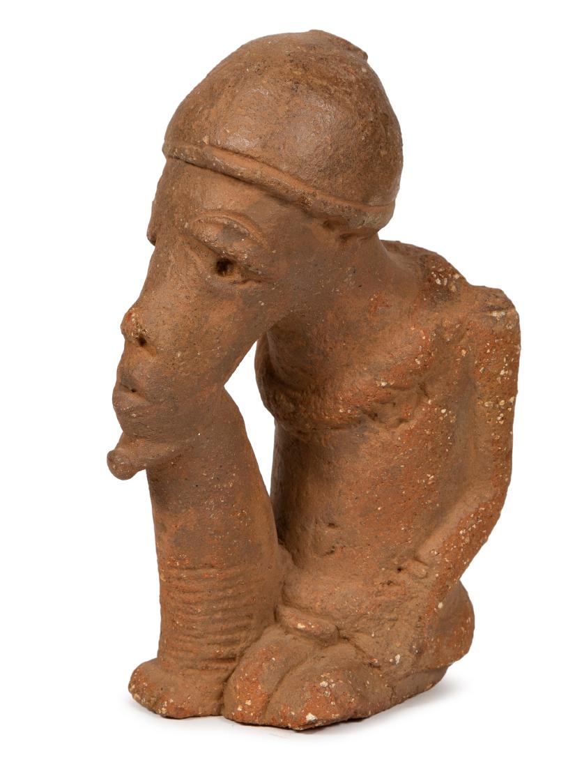 Nok figure-Terracotta of a man. NOK, NIGERIA, II: Nok figure-Terracotta of a man. NOK, NIGERIA, II CENTURY BC - II CENTURY AC. Size 8 inches high. A seated terracotta figure of a bearded man, wearing headdress. Condition: losses at the back otherwise