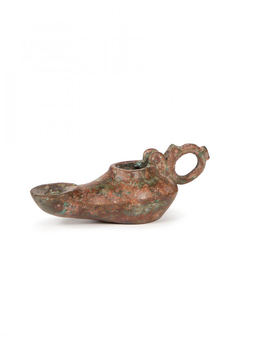 Ancient Byzantine Bronze Oil Lamp c.6th-8th century AD.: Ancient Byzantine Bronze Oil Lamp c.6th-8th century AD. Size 4 3/4 inches length. Fine cast bronze oil lamp with suspension loop handle, missing lid otherwise intact. Provenance: Private NYC Collectio