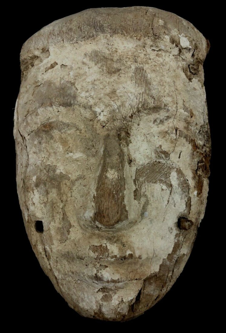 Ancient Egyptian Mummy Wood Mask c.664-332 BC. Size 9: Ancient Egyptian Mummy Wood Mask c.664-332 BC. Size 9 inches high x 6 1/2 inches wide. Fine Ancient Egyptian Mummy wood Mask with fine details painted with white over gesso. Condition: ware and losses