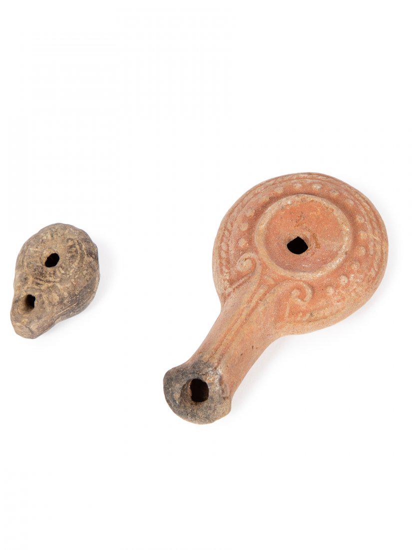 Lot of 2 Ancient Roman Egypt Terracotta Oil Lamps c.2nd: Lot of 2 Ancient Roman Egypt Terracotta Oil Lamps c.2nd Century AD. Size 1 1/2 to 3 7/8 inches length. A Miniature oil lamp together with a fine molded terracotta oil lamp with ornate design. Provenan