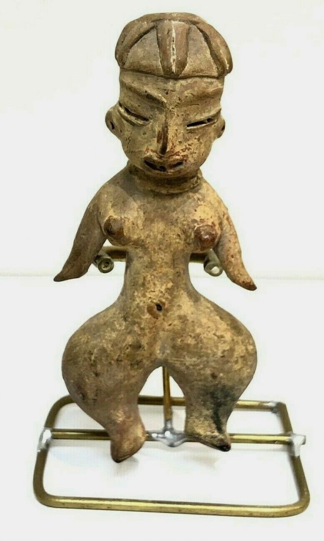 Ancient Pre columbian Tlatilco, Mexico c.1200 BC.: Ancient Pre columbian Tlatilco, Mexico c.1200 BC. size 3 5/8 inches high. Early Man Terracotta Venus wearing a Olmec Mask. right arm restored otherwise in good condition. Provenance: Ex Greenwich CT E