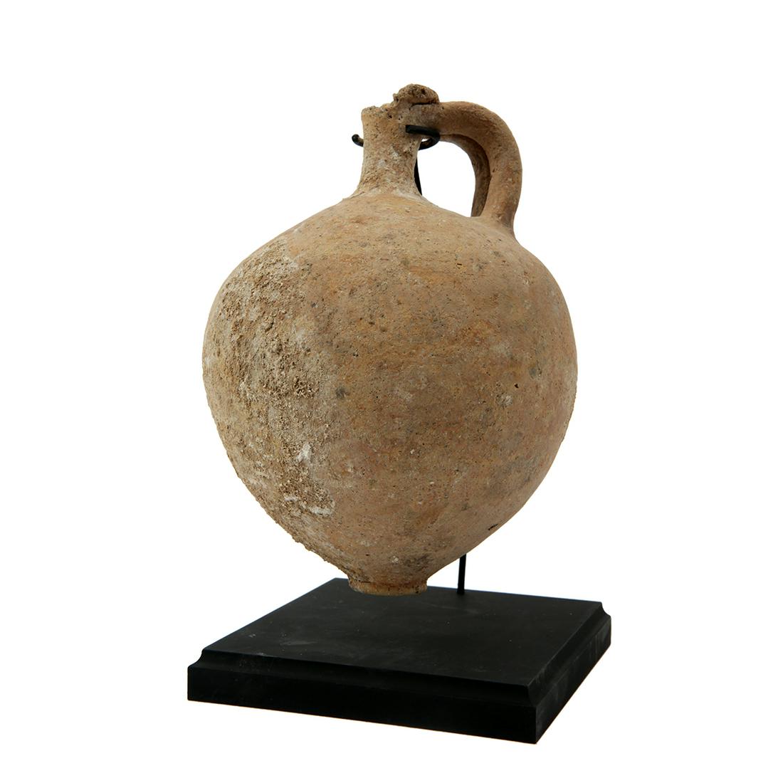 Ancient Holy Land Iron Age Pottery Jug c.1000 BC.: Ancient Holy Land Iron Age Pottery Jug c.1000 BC. Size 7 1/4 inches high + mount. Large pottery juglet with conjoined handle. Condition Rim chipped off otherwise Intact. Provenance Ex Todd Figi Estate