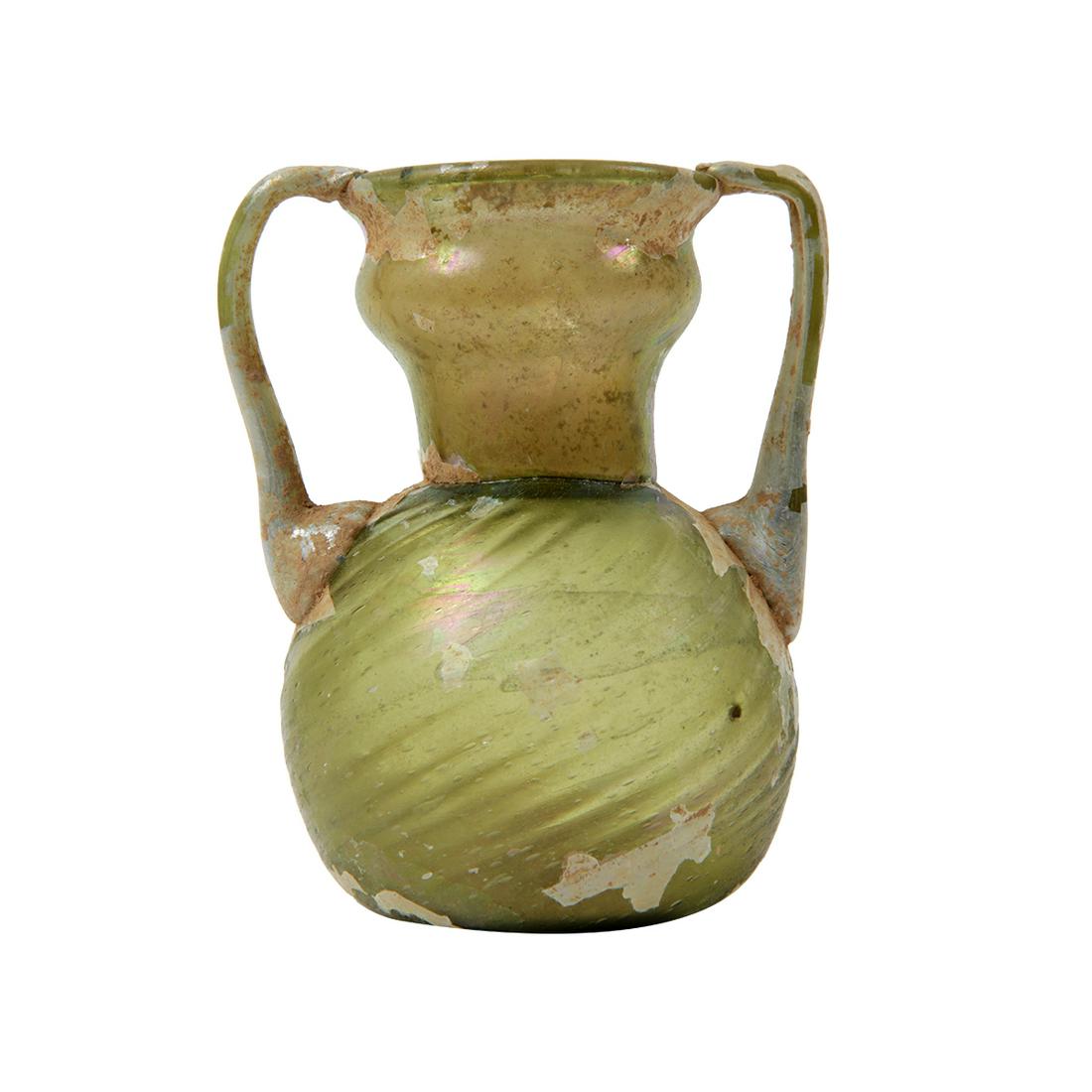 Ancient Holy Land Roman Glass Jar c.1st-2nd century AD.: Ancient Holy Land Roman Glass Jar c.1st-2nd century AD. Size 3 7/8 inches high. Beautiful ancient Roman green glass jar with twin handles, area of iridescent patina. Condition Intact. Provenance Ex To