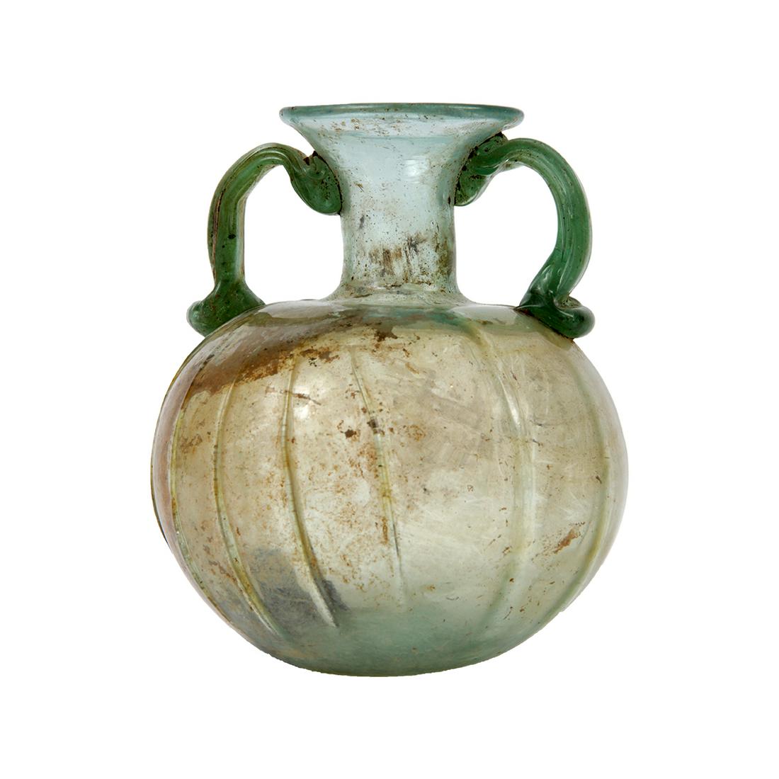 Ancient Holy Land Roman Glass Aryballos c.1st-2nd: Ancient Holy Land Roman Glass Aryballos c.1st-2nd century AD. Size 4 1/2 inches high. Beautiful form ancient Roman green glass Aryballos with twin handles, small area of iridescent patina. Condition I