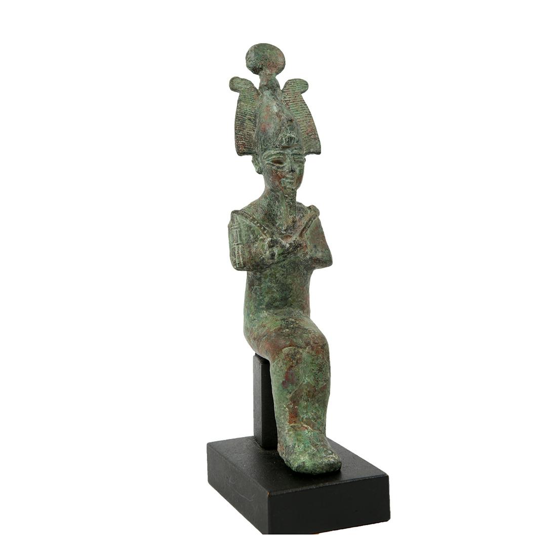Ancient Egyptian Bronze Seated figure of Osiris ca. 700: Ancient Egyptian Bronze Seated figure of Osiris ca. 700 B.C. Size: 7 inches high + mount. A Hollow bronze figure of Osiris Seated wearing atef crown with frontal uraeus, the finely cast features with 