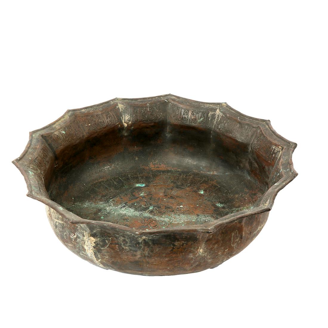 Islamic Persian Seljuk Bronze Basin c.9th century AD: Islamic Persian Seljuk Bronze Basin c.9th century AD. Size 14 1/4 inches diameter. 4 1/4 inches high. Fine Ancient Islamic Persian Basin decorated with Arabic Kufic inscription and floral design. Ex N