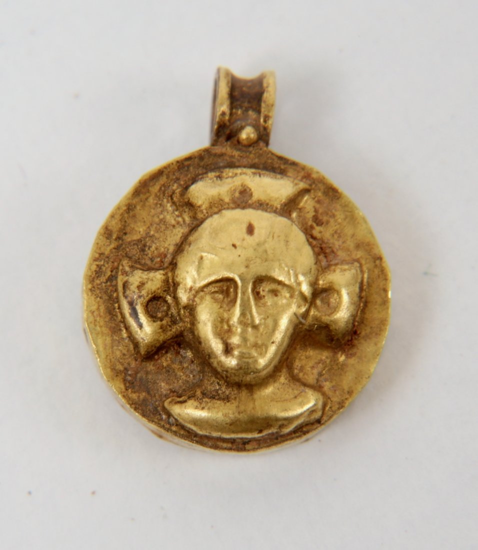Ancient Byzantine Gold Pendant with Christ c.5th-6th: Ancient Byzantine Gold Pendant with Christ c.5th-6th century AD. Size 0 3/8 inch length, weight 1.10 grams. A Hollow high karat gold Byzantine pendant with Christ in the center, Suspension loop. Ex Pr