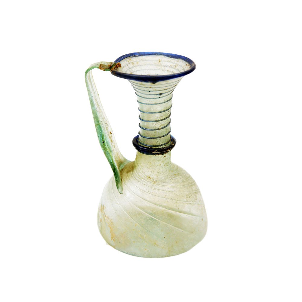 Ancient Roman two color Glass Jug c.2nd century AD.: Ancient Roman two color Glass Jug c.2nd century AD. Size 4 3/4 inches high. Rare two color glass jug with swirl pattern. Nice patina. Provenance: Ex David Saidian Estate New York city. to present owne