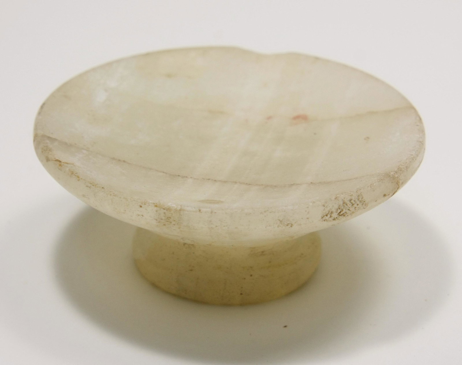 Ancient Egyptian Alabaster Miniature Offering Table Old: Ancient Egyptian Alabaster Miniature Offering Table Old Kingdom c.2600 BC. Size 2 5/8 inches diameter x 1 inch high. (6.6 x 2.54cm) Rare Attractive Ancient Egyptian alabaster Miniature footed offering