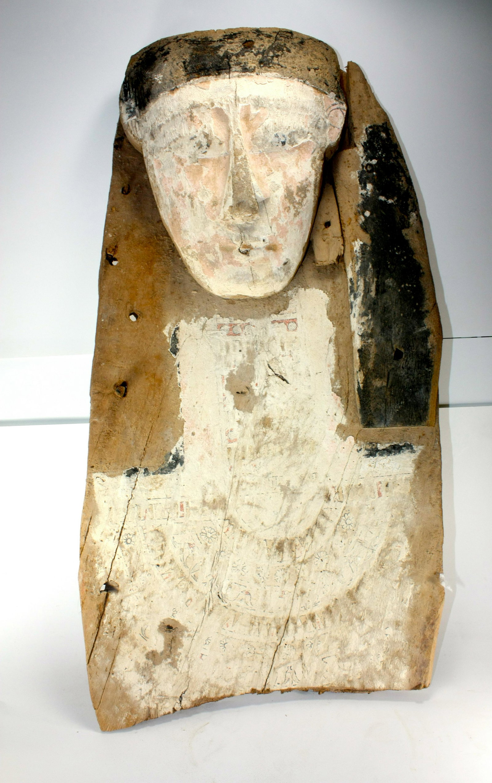 Ancient Egyptian sarcophagus panel Late period, c.: Ancient Egyptian sarcophagus panel Late period, c. 664-332 BC. Size 27 inches length x 14 1/4 inches wide. (68.5 x 36.2 cm) Ancient Egyptian Upper Portion of Sarcophaqus lid with mask, painted over ge