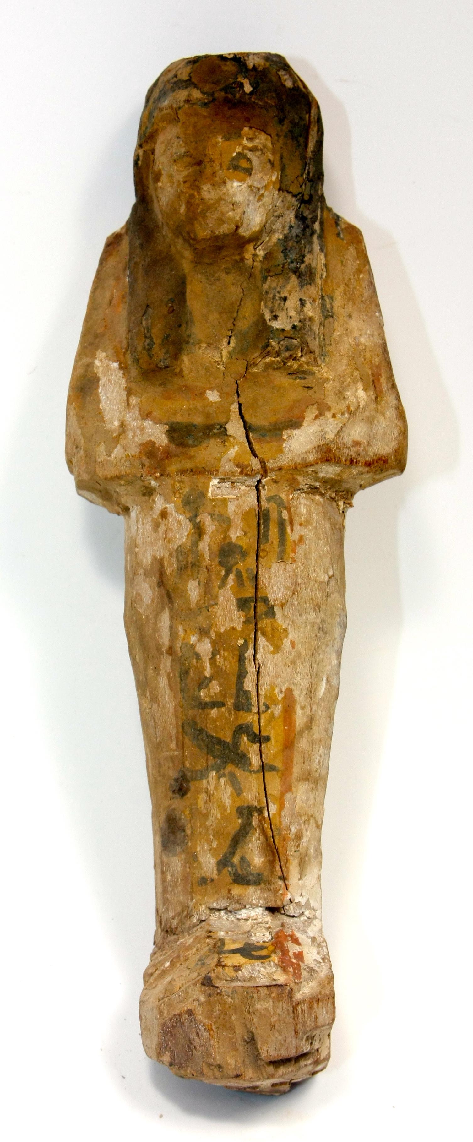 Ancient Egyptian Wood Ushabti Figure c.700 BC.: Ancient Egyptian Wood Ushabti Figure c.700 BC. Size 8 inches high (20.3 cm). Large carved hardwood ushabti, wearing the royal wig. having vertical glyph register down front leg. Provenance:Private NYC