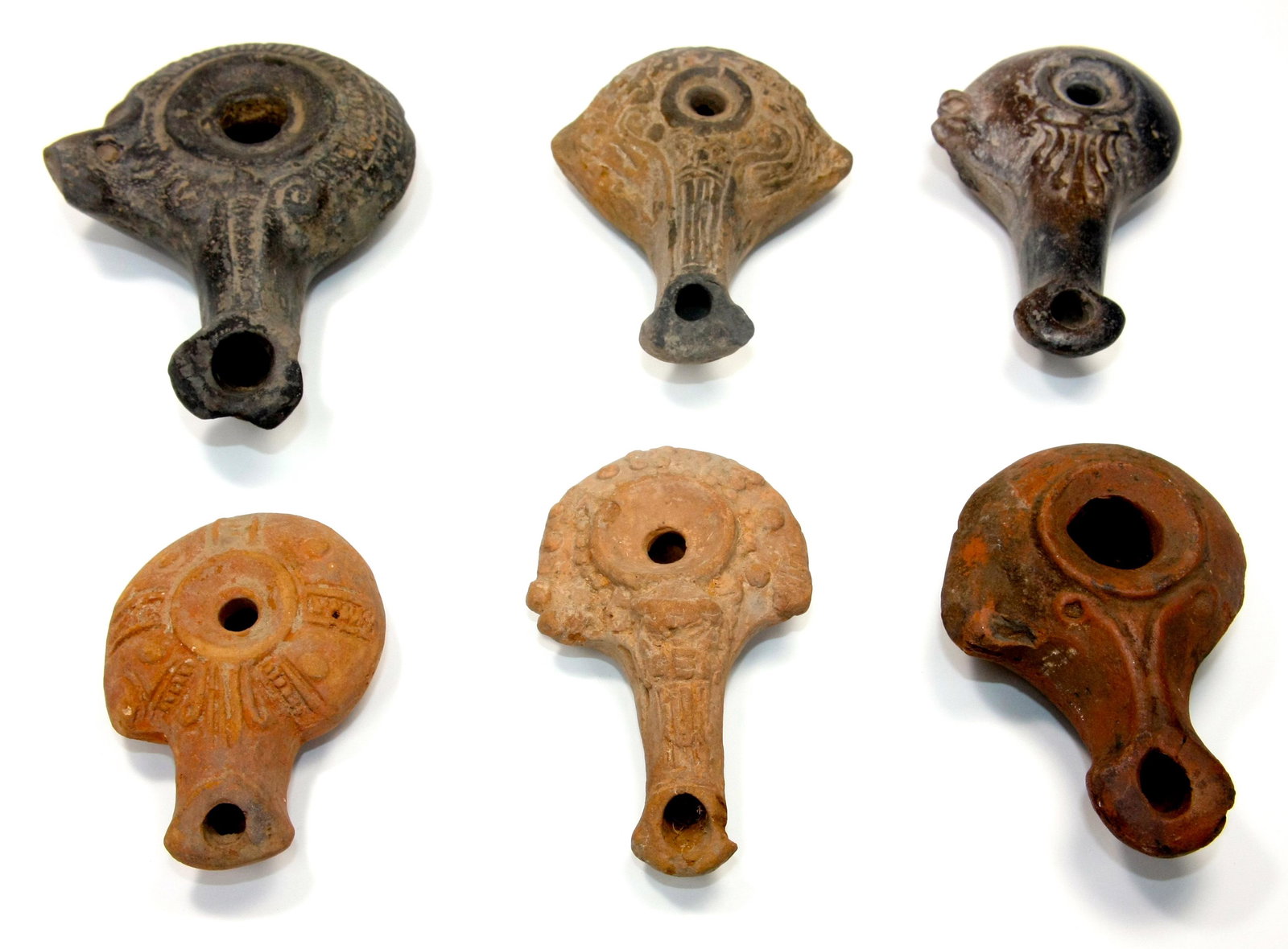 Lot of 6 Ancient Egyptian Hellenisitic Terracotta Oil: Lot of 6 Ancient Egyptian Hellenisitic Terracotta Oil Lamps c.2nd century AD. Size 3 1/4 - 5 3/8 inches length (8.25 - 13.65 cm) Great Lot of 6 Hellenisitic Terracotta oil lamps. Rare... Provenance. P