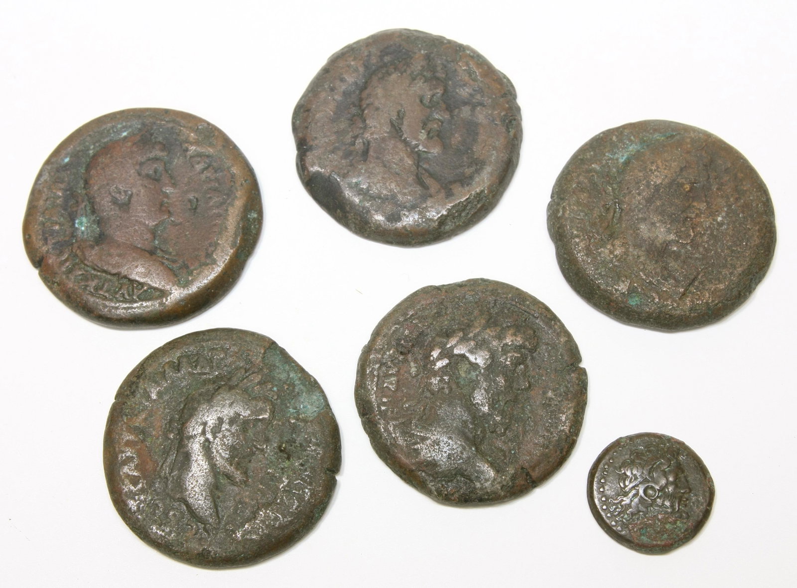 Lot of 6 Ancient Egyptian Roman Bronze Drachma Coins: Lot of 6 Ancient Egyptian Roman Bronze Drachma Coins c.2nd century AD. Size 34 - 18 mm. Great Lot of 5 Roman Egypt Antoninus Pius Drachma coins. together with Ptolemy Egypt Bronze coin with Zeus and E