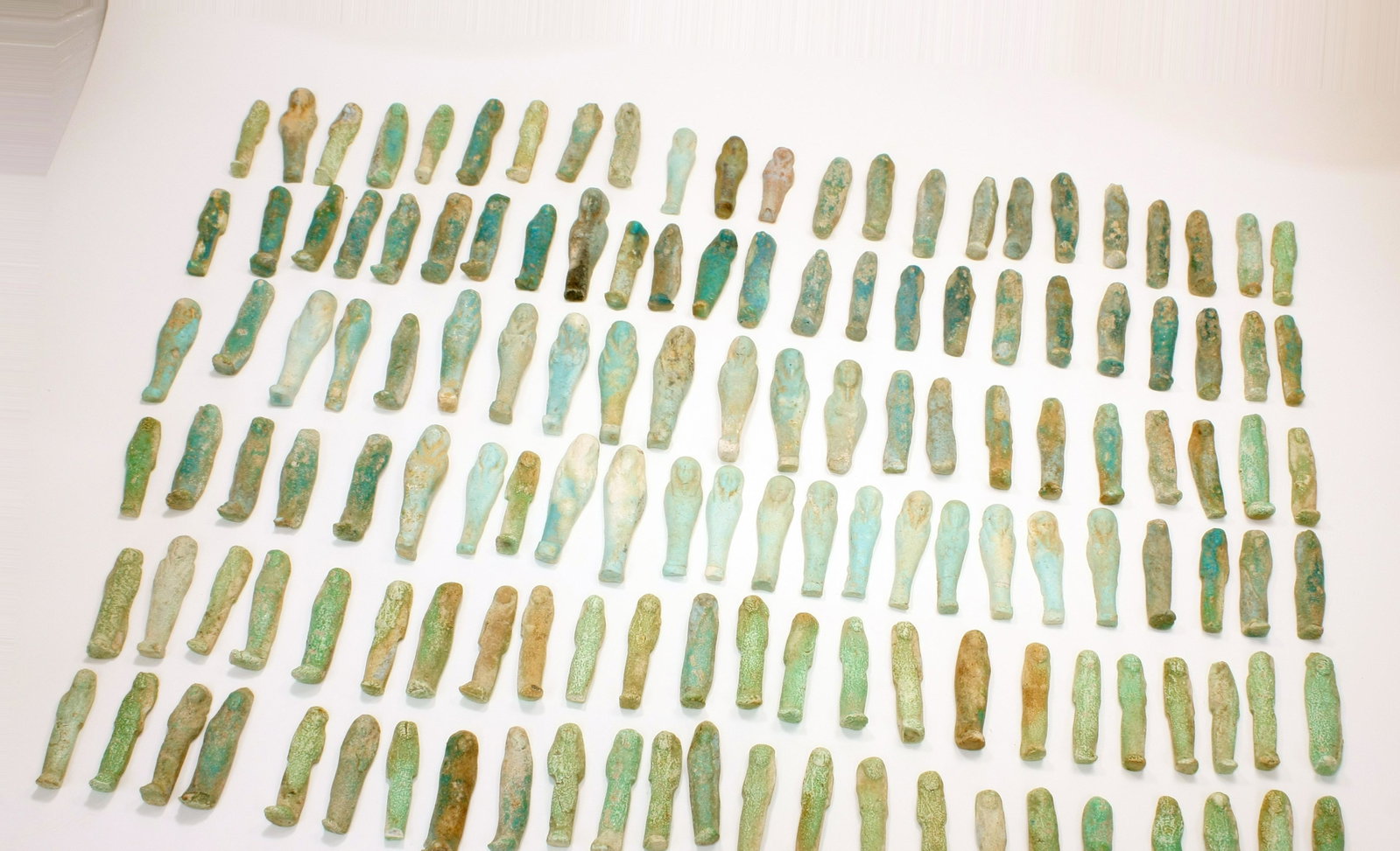 Lot of 170 small Ancient Egyptian Faience Ushabti: Lot of 170 Ancient Egyptian Faience Ushabti Figures c.700 BC. Size 2 - 2 3/4 inches high.(5.8-6.9 cm) A great collection of 170 blue and green glazed faience ushabti figures. Provenance: Private NYC c