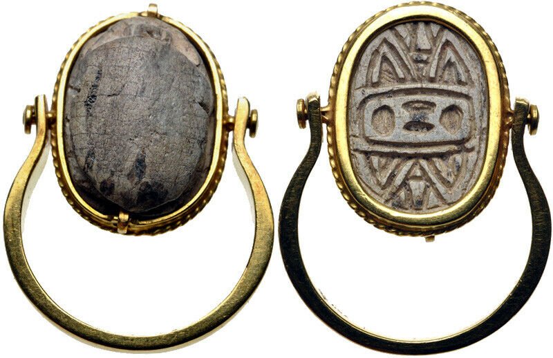 Ancient Egypt. Hyksos Period. 1650-1550 BC. Scarab Ring: Ancient Egypt. Hyksos Period. 1650-1550 BC. Steatite scarab Ring. Set in modern 18kt yellow gold mount (scarab 17mm, in setting 28.5mm). Simple carving. Pierced for suspension. On face of scarab: Hyks