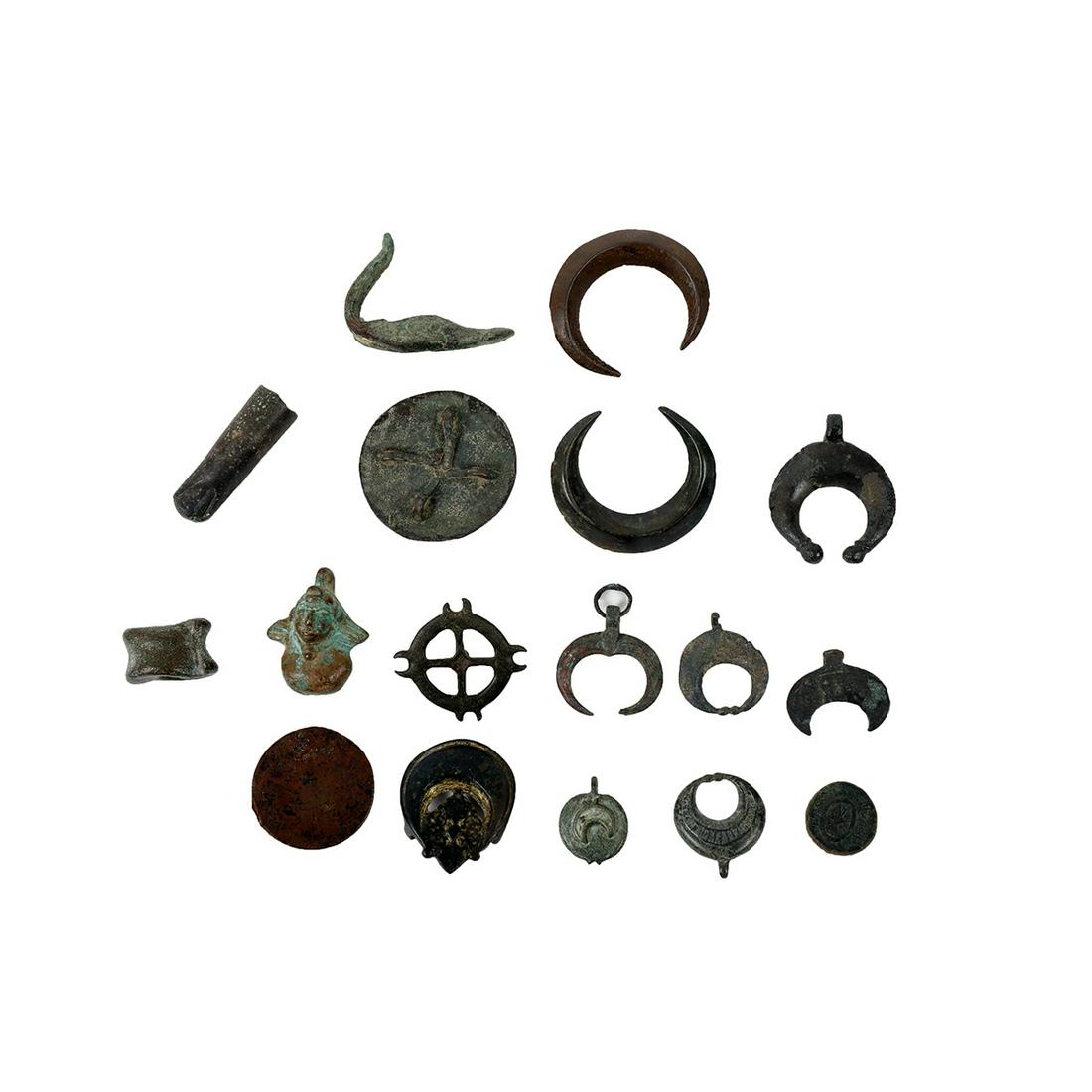Lot of 17 Ancient Roman and Islamic Bronze Fragments: Lot of 17 Ancient Roman and Islamic Bronze Fragments c.1st-12th century AD. Size 1 3/4- 0 3/4 inches length. Fine lot of antiquities consist of ancient Roman bronze bust of Eros, a bronze fingre, a br