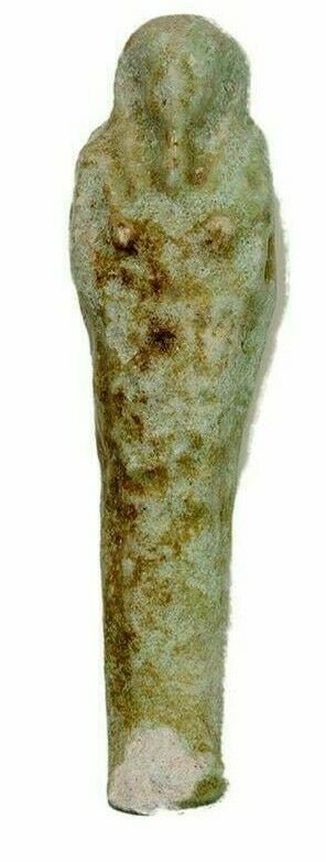 Ancient Egyptian Green Faience Ushabti Figure c.664-332: Ancient Egyptian Green Faience Ushabti Figure c.664-332 BC. Size 4 1/4 inches high. A green glazed faience ushabti figure, wearing the royal wig and beard, holding implements and seed sack on back wit