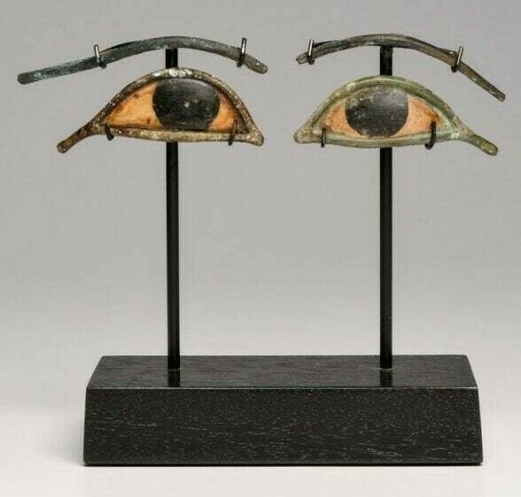 Ancient Egyptian Pair of mummy mask eyes with brows,: Ancient Egyptian Pair of mummy mask eyes with brows, c.664-332 BC. Size 3-1/8” to 3-3/4”W. Fine Egyptian Mummy mask eyes and brows, the eyes have a cast bronze outer frame inset with paste glass e