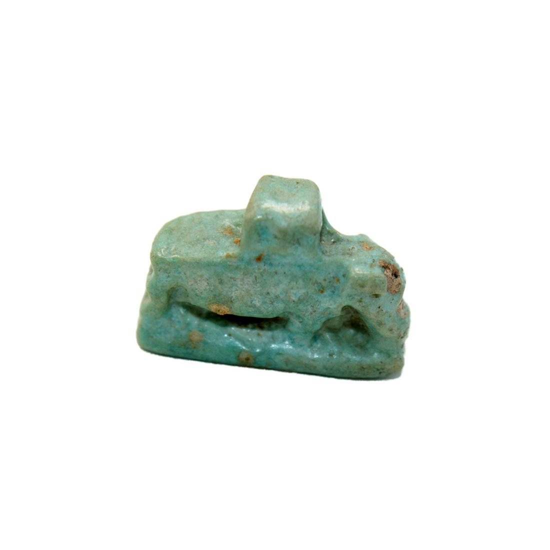 Ancient Egyptian Blue-Green Faience Hippo Amulet Late: Ancient Egyptian Blue-Green Faience Hippo Amulet Late Period c.5255-332 BC. Size 18 x 13 mm. Fine Green-blue Faience Hippo Amulet. The type of amulet has positive associations with Taweret, the goddes
