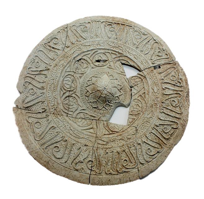 Rare Islamic Fatimid Dynasty Terracotta Medallion with: Rare Islamic Fatimid Dynasty Terracotta Medallion with Arabic Calligraphy c.8th century AD. Size 6 1/8 inches diameter. Thin molded clay medallion, a fragment from a larger vessel decorated with Arabi