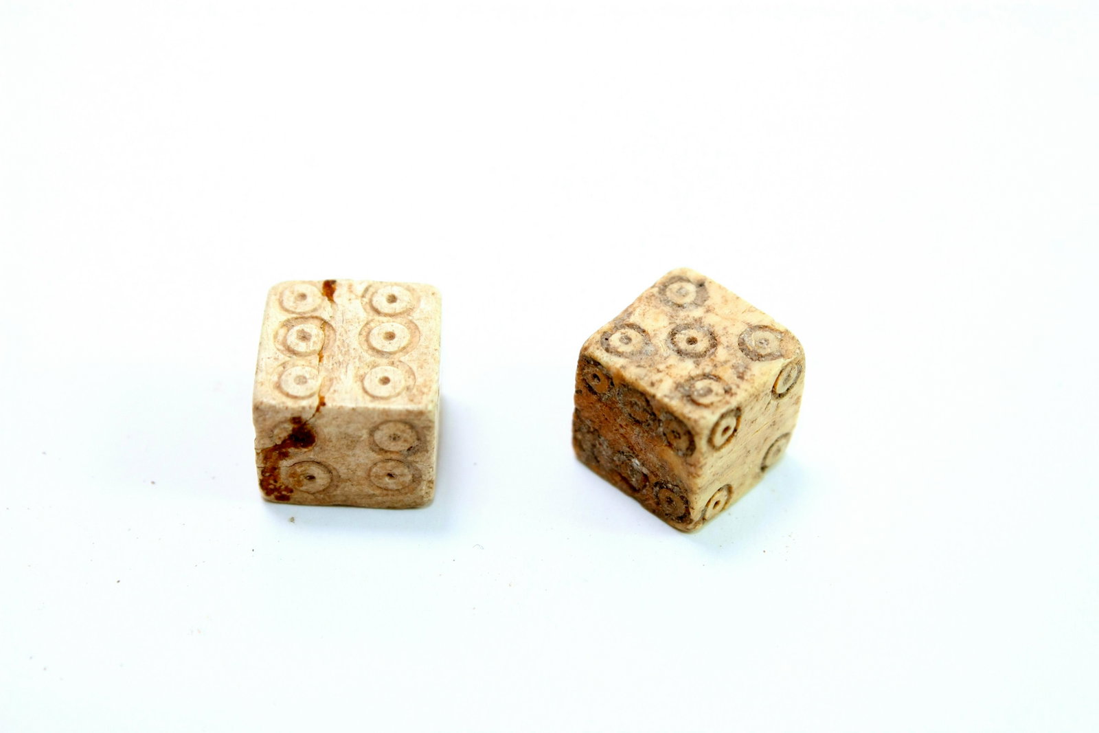 A Pair of Ancient Roman Bone Dice c.1st-2nd century AD.: A Pair of Ancient Roman Bone Dice c.1st-2nd century AD. Size 0 1/4 inches length. Great quality pair of carved bone dice. Provenance Ex Robert Horbacz Estate, New York. Acquired from David Hendin Amph